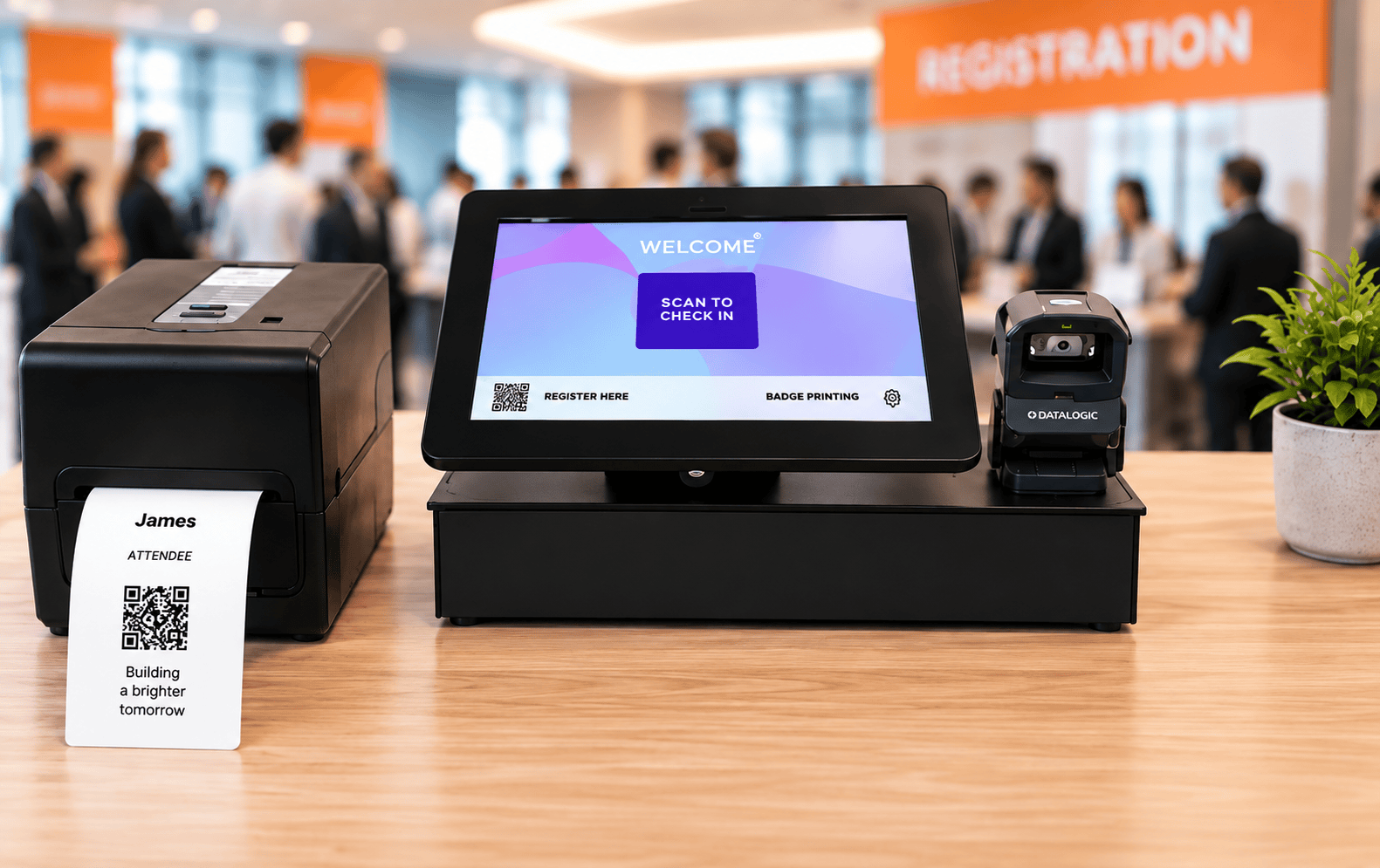 Self check-in kiosk with badge printer and QR scanner set up at a registration desk